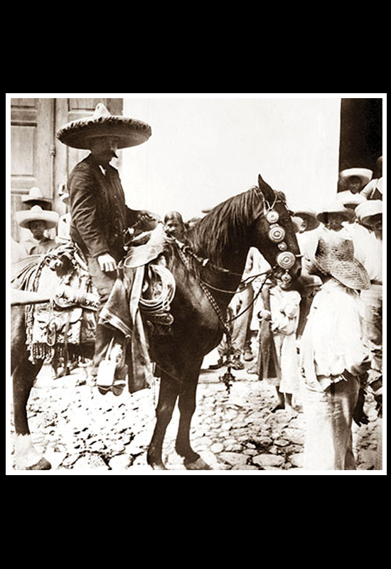 Gral. Emiliano Zapata a caballo y un niño